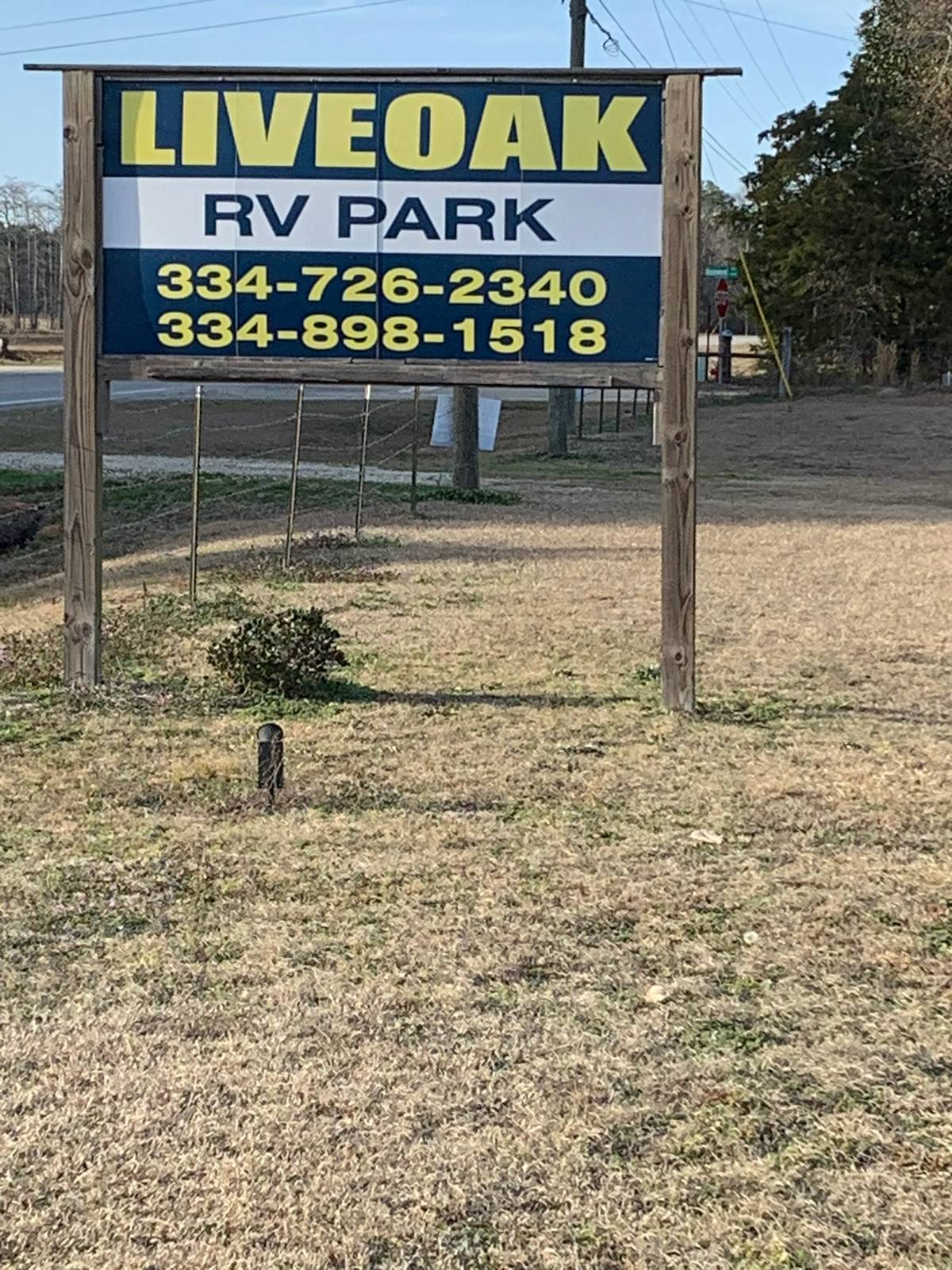 sign in front of driveway to live oak rv park in samson al